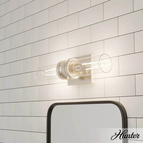 Lenlock 2 Light Brushed Nickel Vanity Light Dimmable Modern Style Seeded Glass Shade mounted on white tiled wall above mirror.