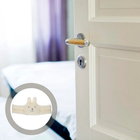 Cute White Fluff Door Stopper With Anti Slam Clip on open door, kid-safe design for noise reduction and protection.