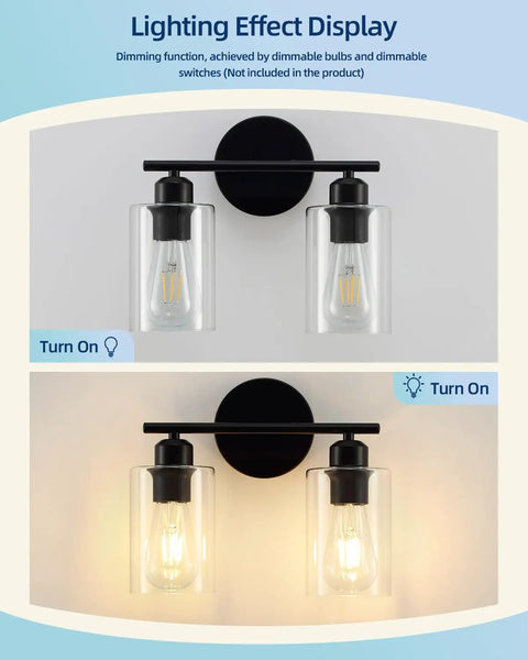 Lighting effect display of Snag This Top Shelf Matte Black Two Light Bathroom Vanity Fixture With Clear Glass Shades.