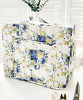 Front view of floral quilted Sewing Machine Cover With Storage Pockets And Quilted Floral Dust Cover Foldable Fabric Storage Basket.