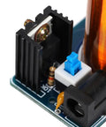 Close-up of Mini Coil Kit Module With LED Light DC 9 To 12V Power Transmission on a compact PCB with components