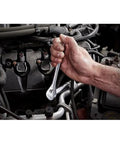 Kickass 191 Piece Mechanics Tool Set With Deep Socket Wrenches Ratchets Hardened Chrome Steel For Underhood Auto Repair and Garage Builds Beast Mode Workhorse, hand using ratchet on engine.