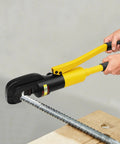 Heavy Duty Hydraulic Rebar Cutter 13 Ton Cuts Up To 22mm Steel Rods being operated on a steel rod on a wooden surface.