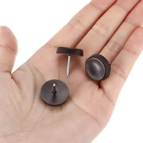 Brown Three Quarters Inch Nail On Furniture Glides 25 Pcs Chair Leg Floor Protectors shown in a hand