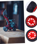 8 Pack Toy Car Wheels Set With Anti Skid Plastic Tires for RC cars and model toys, shown with red wheel rims on a mini loader model