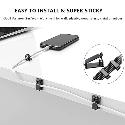 Close-up of All In One Cable Boss Kit with clips and cord holders securing wires on a desk surface; ideal for TV and home electronics.