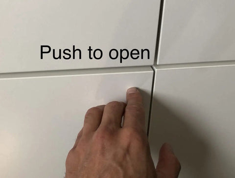 Smooth Push To Open Cabinet Door Dampers With Magnetic Lock Set Of Three Handleless Drawer Latches For Modern Kitchen Furniture Silver Metallic Finish Easy Click Action No More Fumbling, hand pressing cabinet door.