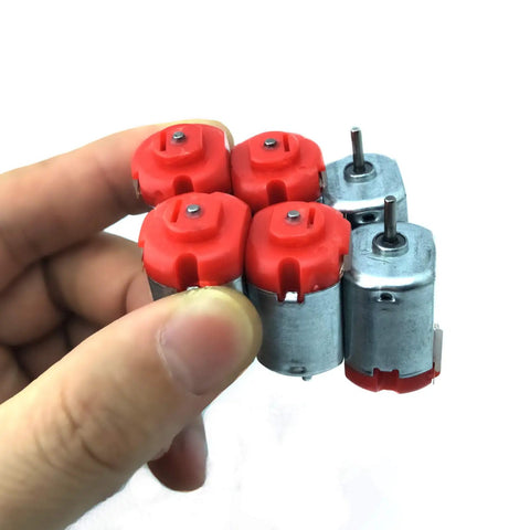 Close-up of 18 Piece DC Motors Kit for DIY Projects showing four mini electric hobby motors, 3V to 12V, up to 25000 RPM.