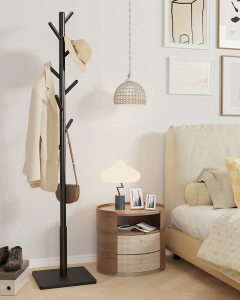 Solid Beech Wood Coat Rack Tree With Eight Hooks And Three Adjustable Heights For Bedroom Hallway Entry And Office Black Finish 11.8 By 70.8 Inches Square Base 1 Pack in a bedroom setting
