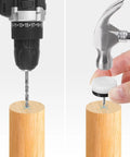 Tough As Nails 40 Pack Furniture Sliders Nail On Chair Leg Protectors installation process with a drill and mallet on wood.