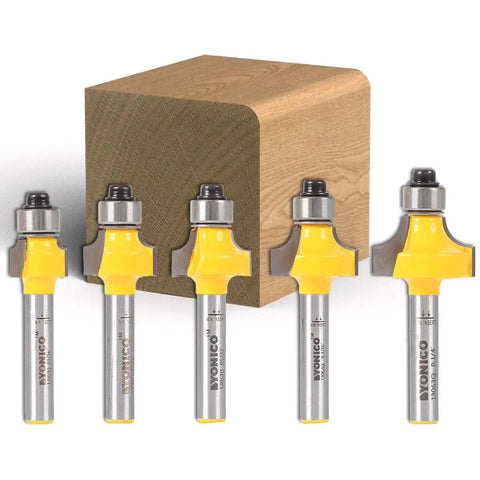 Top Shelf Roundover Router Bits Edge Forming Set Featuring Five Mini Quarter Inch Shank Blades Built With Badass Tungsten Carbide To Slice Wood Like Butter On Any Table Or Handheld Router Without Breaking A Sweep. Five mini router bits with yellow accents and a wood block.