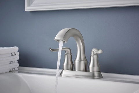 Hamden Spot Resist Brushed Nickel Two Handle 4 Inch Centerset Bathroom Faucet with water flowing in modern sink setting