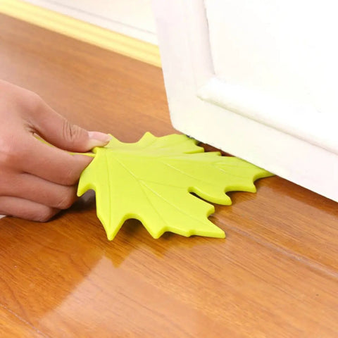 Hand positioning Maple Leaf Door Wedge Stops Four Pack for slam free doors and floor protection, sturdy PP material, safe odorless design.