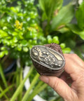 Close-up of alloy copper fitting on sword handle Tsuka with real Samegawa stingray skin grip for authentic Samurai look.