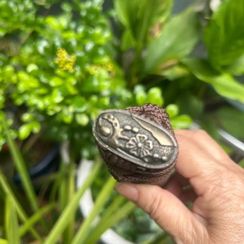 Close-up of alloy copper fitting on sword handle Tsuka with real Samegawa stingray skin grip for authentic Samurai look.