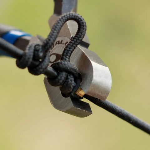 Close-up of Forty Pack Brass Bowstring Nock Points For Archery Tuning Durable Buckle Clips with Non Slip Nylon Lining