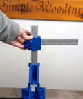 Kickass Adjustable Dust Collection Rig For Split Bed Wood Lathes With Tight Four Inch Hose Hookup And Three Way Flex Brackets For Hassle Free Woodworking Cleanup, showing blue flex arms and handle adjustment.