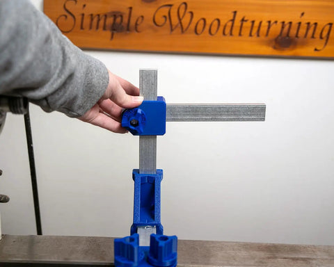 Kickass Adjustable Dust Collection Rig For Split Bed Wood Lathes With Tight Four Inch Hose Hookup And Three Way Flex Brackets For Hassle Free Woodworking Cleanup, showing blue flex arms and handle adjustment.