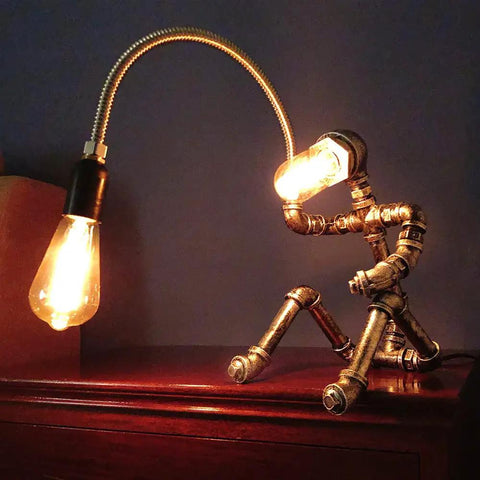 Dope Handcrafted Steampunk Water Pipe Robot Desk Lamp With Vintage Industrial Vibe for bedside and desk lighting.