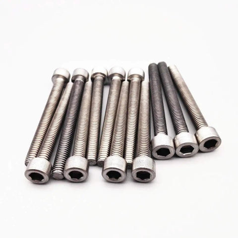 Badass Grade 2 Beefy Titanium M6 Hex Head Bolts 75Mm Long Din912 Standard arranged in a row, showing different finishes.
