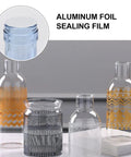 Premium Aluminum Foil Seal Gaskets For Plastic Bottles and Glass Containers shown on assorted clear glass jars.