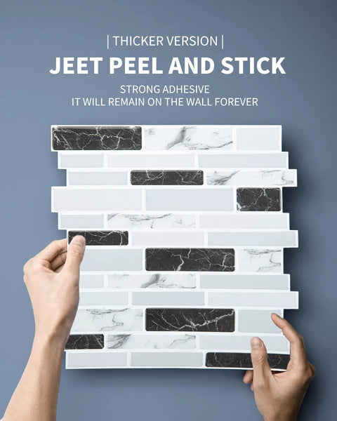 Hands holding Thick 2mm To 2.5mm Peel And Stick Marble Backsplash Tiles 12x12 10 Pack With 3x Stronger Adhesive against a wall.