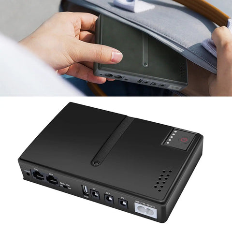 Zero Stress DC UPS Backup Power Supply Providing 18W Multi Output For Routers And Cameras US Plug compact backup power unit held in hand.