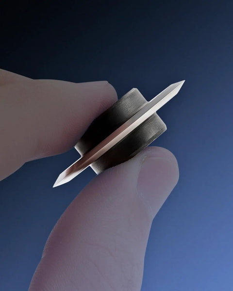 Person holding Pro-Grade Replacement Blade for Copper Wire Strippers, Cr12MoV Cutting Edge, 1.3 Inch Outer Diameter, includes shaft.