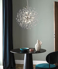 Sputnik Crystal Chandelier With Firework Chrome Finish, Dandelion Style Pendant Light Fixture, 9 Lights, hanging over dining table.