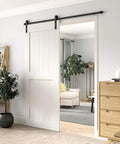Heavy Duty 6 Foot Sliding Barn Door Hardware Kit For Single Door Featuring Hard Core Black Aluminum Track, installed in modern interior.