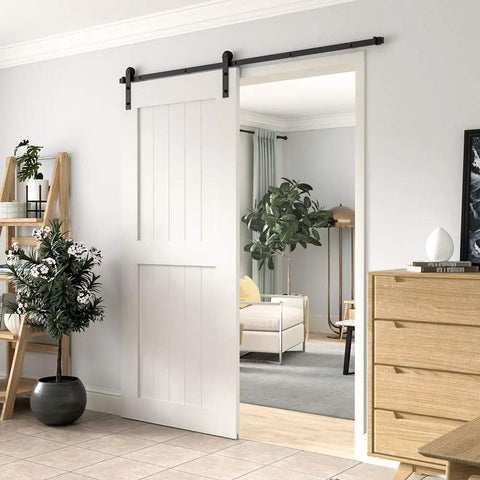 Heavy Duty 6 Foot Sliding Barn Door Hardware Kit For Single Door Featuring Hard Core Black Aluminum Track, installed in modern interior.