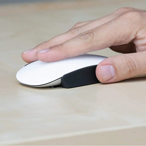 Hand using Magic Grips For Apple Magic Mouse 1 And 2 - Wider, More Comfortable Grip For All Hand Sizes on a white mouse