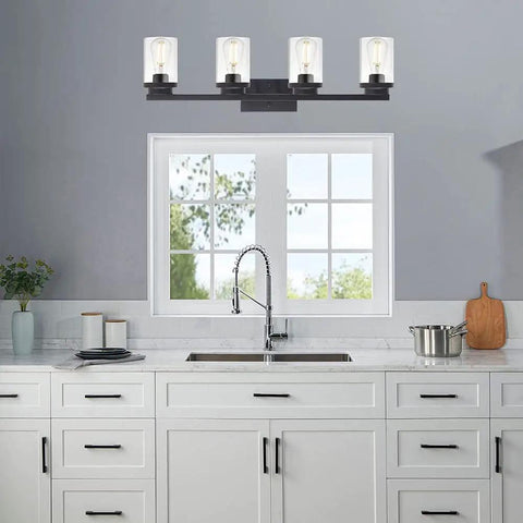 Four Light Vanity Light Fixture In Matte Black With Clear Glass Shades above kitchen sink, modern industrial design, E26 base