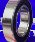 Premium 61903-2RS Bearing 17x30x7mm - Sealed Ball Bearing standing upright against blue background