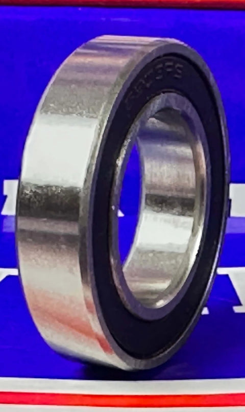 Premium 61903-2RS Bearing 17x30x7mm - Sealed Ball Bearing standing upright against blue background