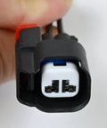 Close-up of Abs Wheel Speed Sensor Connector Pigtail Wiring Harness with black casing and visible connectors