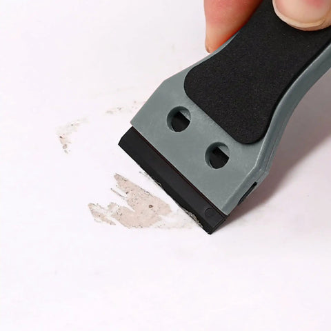 Two Pack Plastic Razor Scraper With Six Inch Long Handle And One Hundred Double Edge Blades, Heavy Duty Adhesive Remover in use on surface