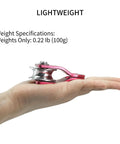 Ultra Portable Micro Single Pulley For Rigging And Climbing Rescue, Compact red pulley in hand, lightweight magnesium-aluminum alloy