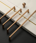 Four Champagne Bronze Cabinet Pulls 5 Inch Center To Center Pack Of 10 With Screws Included Kitchen Cabinet Handles on a white surface