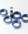 Blue Rubber Sealed 10x15x4mm Ball Bearings For RC Cars With 10mm Inner Bore 2RS Miniature Bearings arranged on a surface