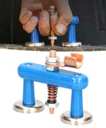 Heavy Duty Magnetic Welding Support Clamp With Rock Solid Suction For Red Copper And Aluminium Alloy Sheets, gripping metal sheets in hand.