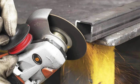 Zip Plus Cutoff Wheel 7 Inch Beefy Heavy Duty Abrasive Wheel 30 Grit cutting steel with angle grinder, sparks visible.