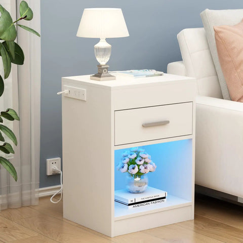 Ultra Sleek White Nightstand Packs A Rapid Charging Hub And Ambient Led Lighting While Guarding A Legit Hidden Safe For Stashing Cash And Electronics Plus Extra Power Outlets with floral decor and lamp.