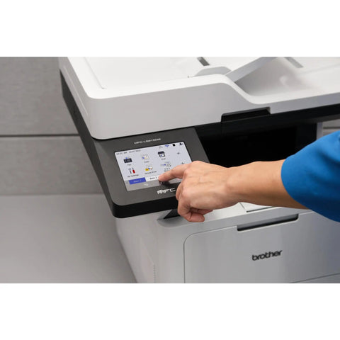 Person using touchscreen on Professional Monochrome Laser All In One Printer With Scanner And Copier Lightning Fast 50 Ppm Printing Wireless Network Ready With Dual Band WiFi Auto Duplex Print For Busy Offices Model MFC L5915DW