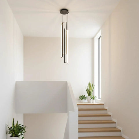Sleek Modern LED Chandelier With Three Lights Black Kitchen Island Pendant For Living Room Dining Room Foyer Remote Dimmable High Ceiling Fixture 33 Inch Tall 6 Inch Wide shown in well-lit stairwell.
