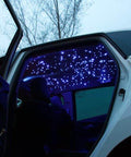 Bluetooth RGBW Fiber Optic Star Ceiling Kit With App Control installed in car interior, showing twinkling lights effect.