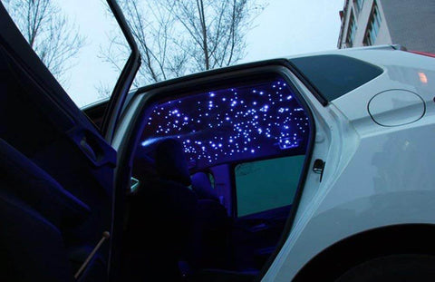 Bluetooth RGBW Fiber Optic Star Ceiling Kit With App Control installed in car interior, showing twinkling lights effect.