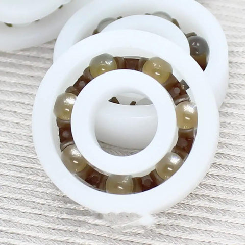 Premium Pom Plastic Ball Bearings 5 Piece Kit showing white polymer with brown balls for smooth rotation in use.