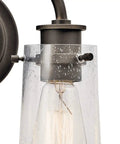 Close-up of Industrial Vintage Two Light Vanity Light With Clear Seeded Glass In Olde Bronze Finish For Bathroom Or Powder Room