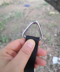 Person holding Beefy Stainless Steel 316 Marine Grade Triangle Ring Buckle Welded V Shaped Heavy Duty Ring with black strap attached